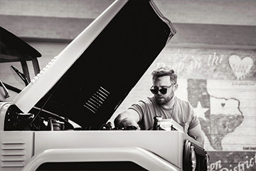 Man working on Land Cruiser in a garage